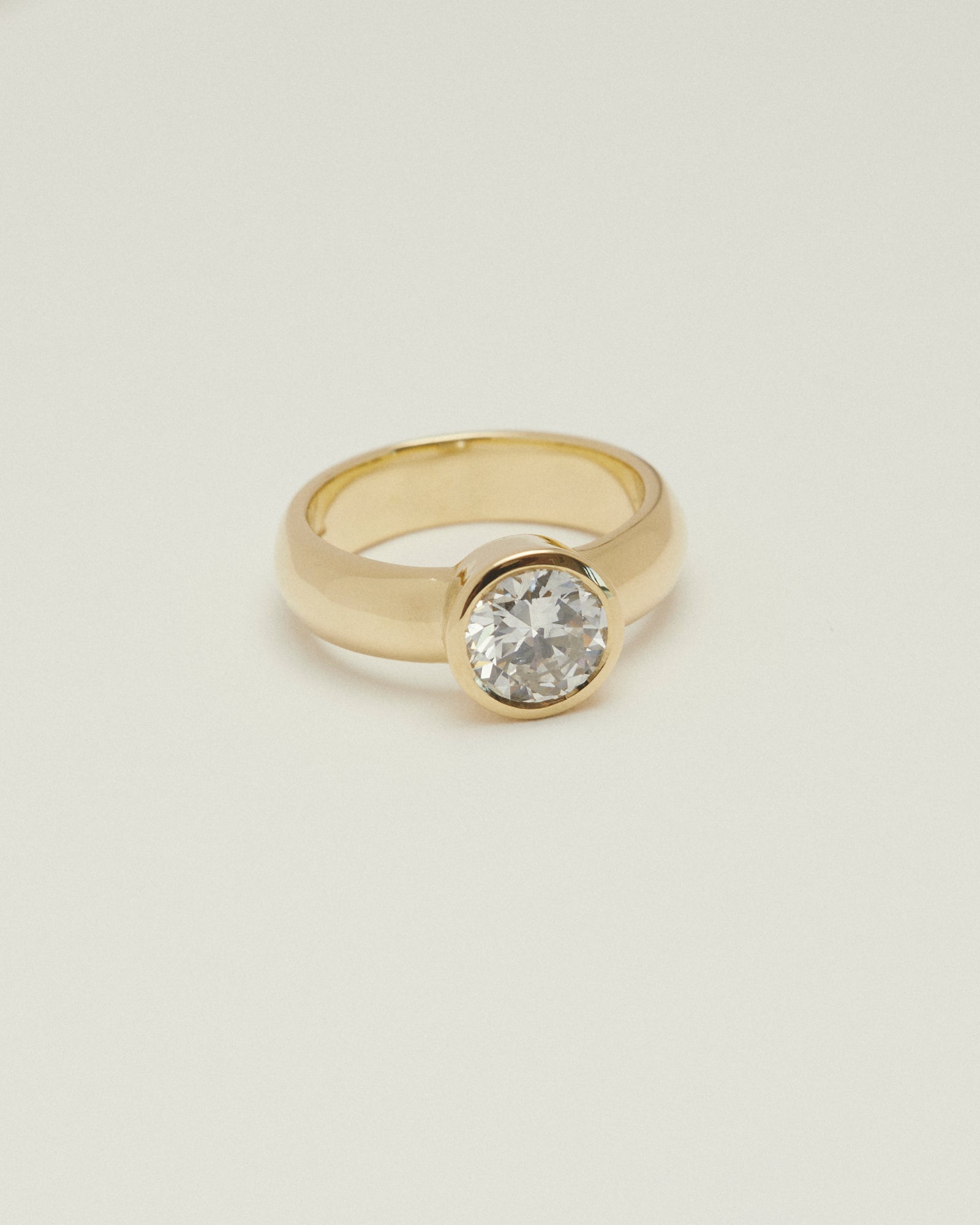 1.402ct early round brilliant cut diamond chunky bezel solitaire.