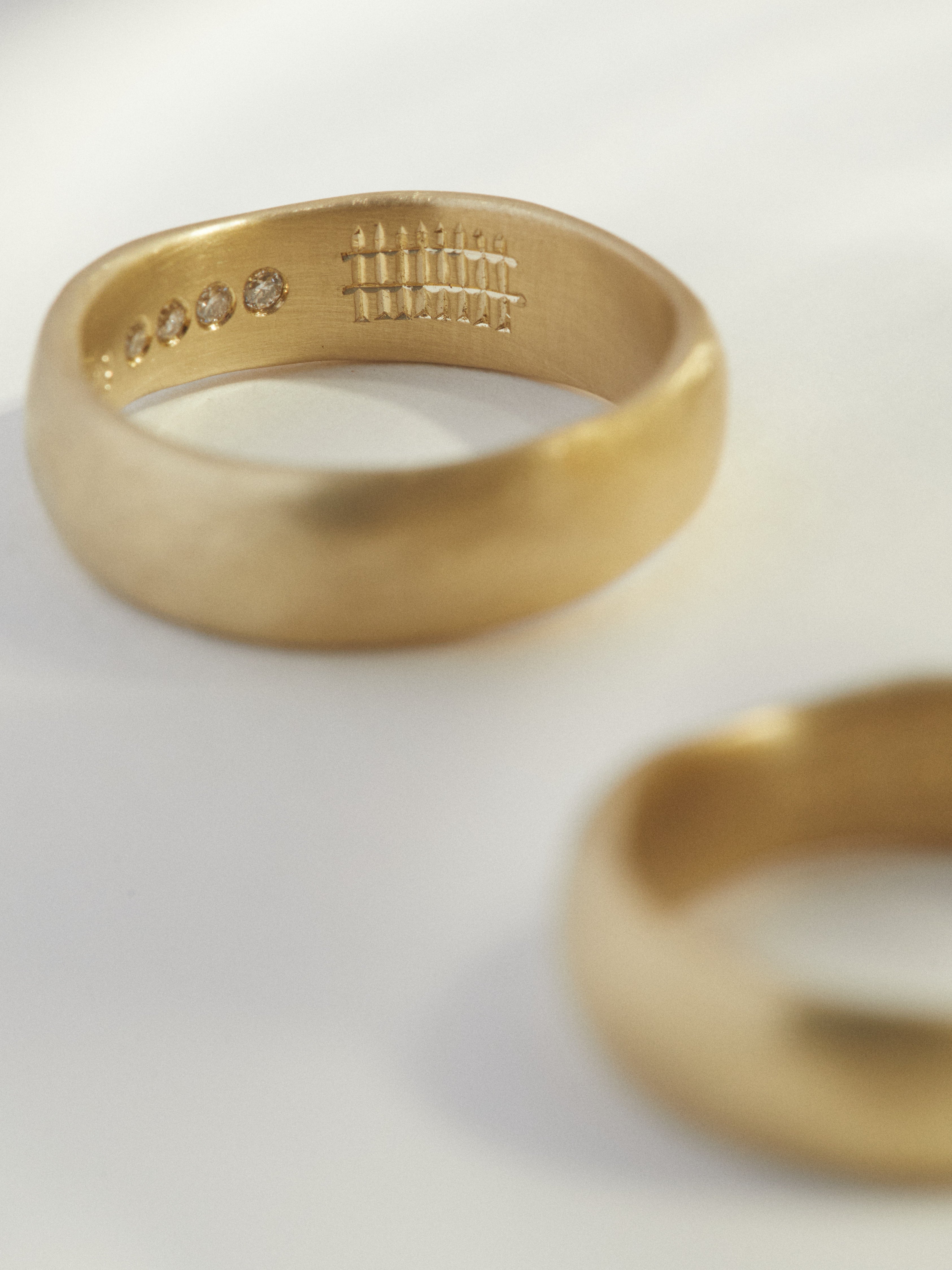 Organic hand carved wedding band set with hidden detail.