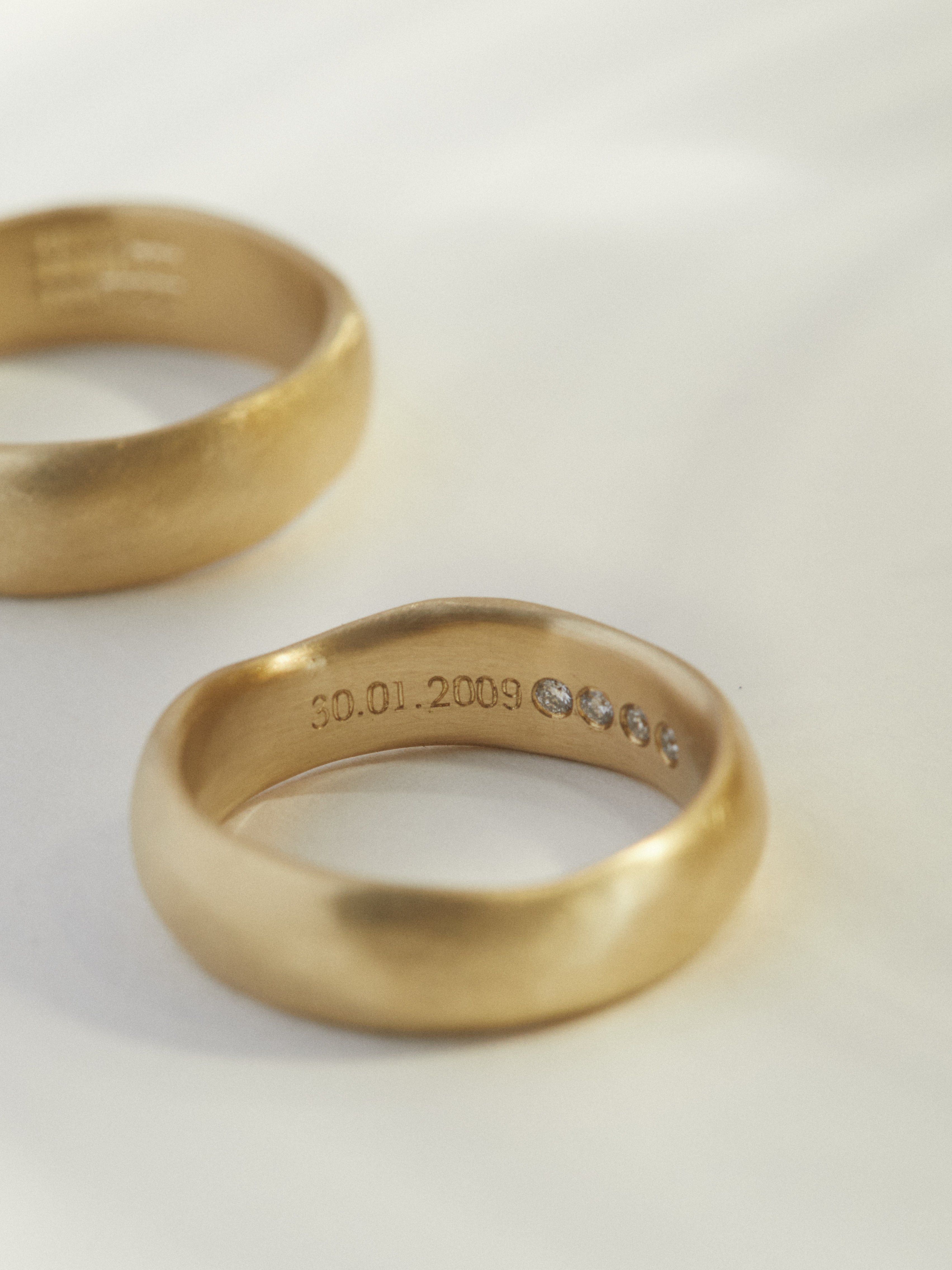 Organic hand carved wedding band set with hidden detail.