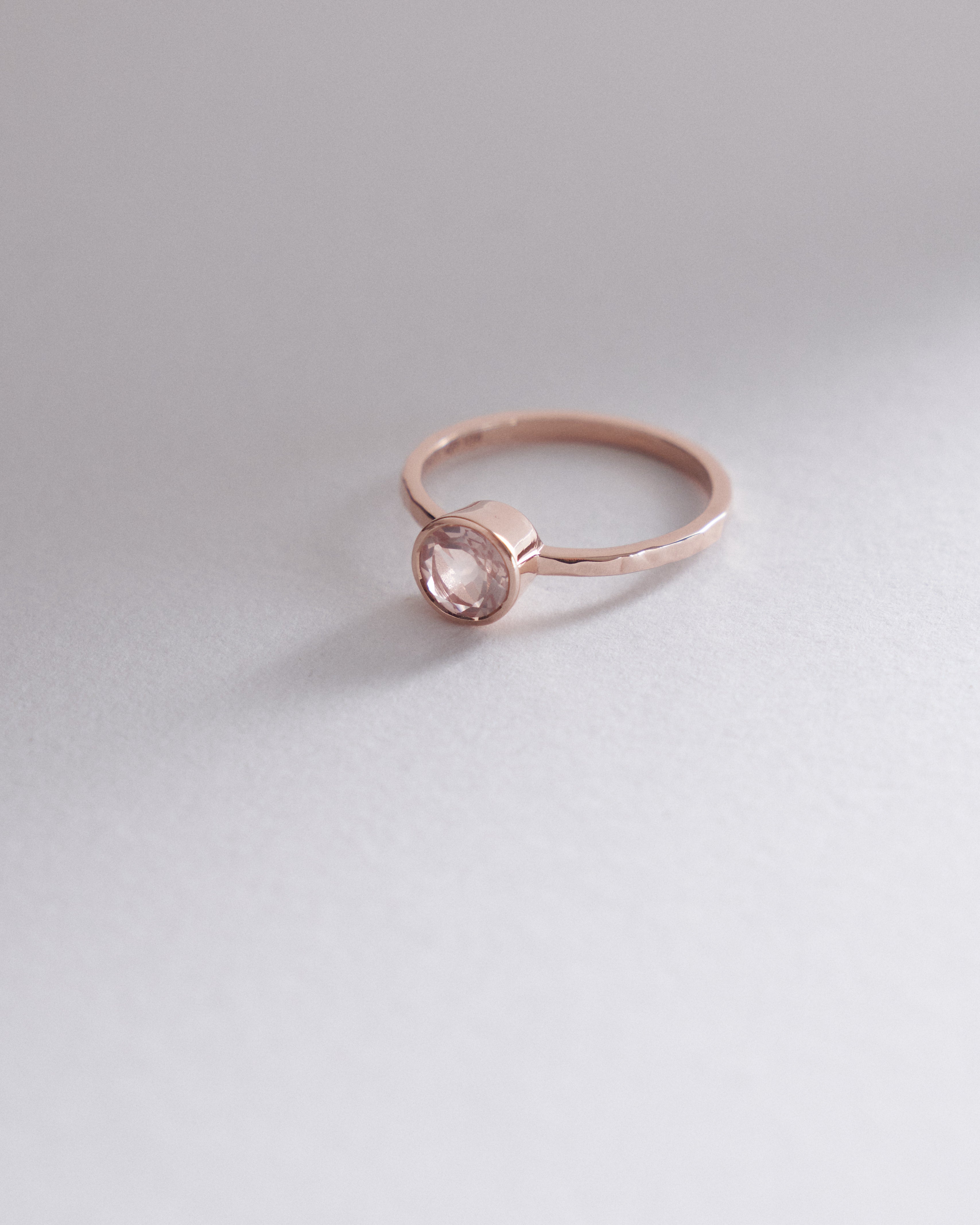 6mm round brilliant cut rose quartz dainty bezel solitaire.