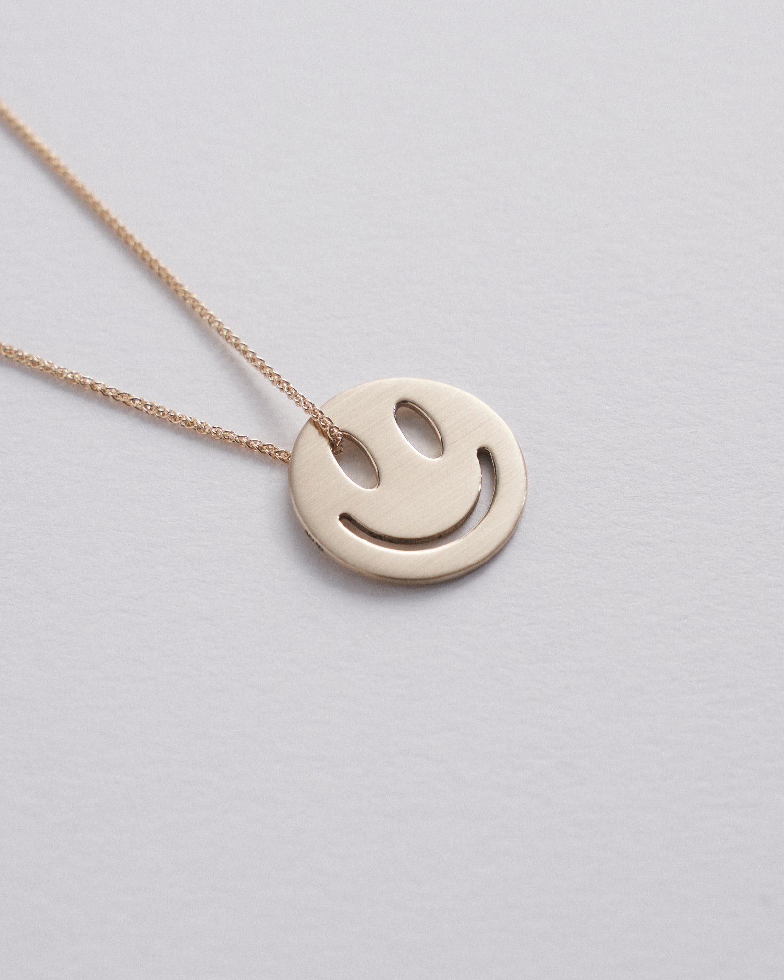 20mm cut out smiley pendant